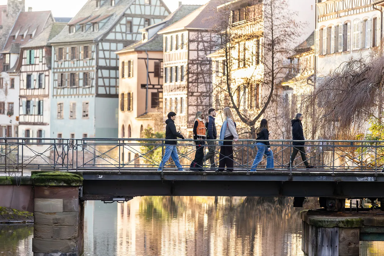 Students walking over a bridge in Strasbourg